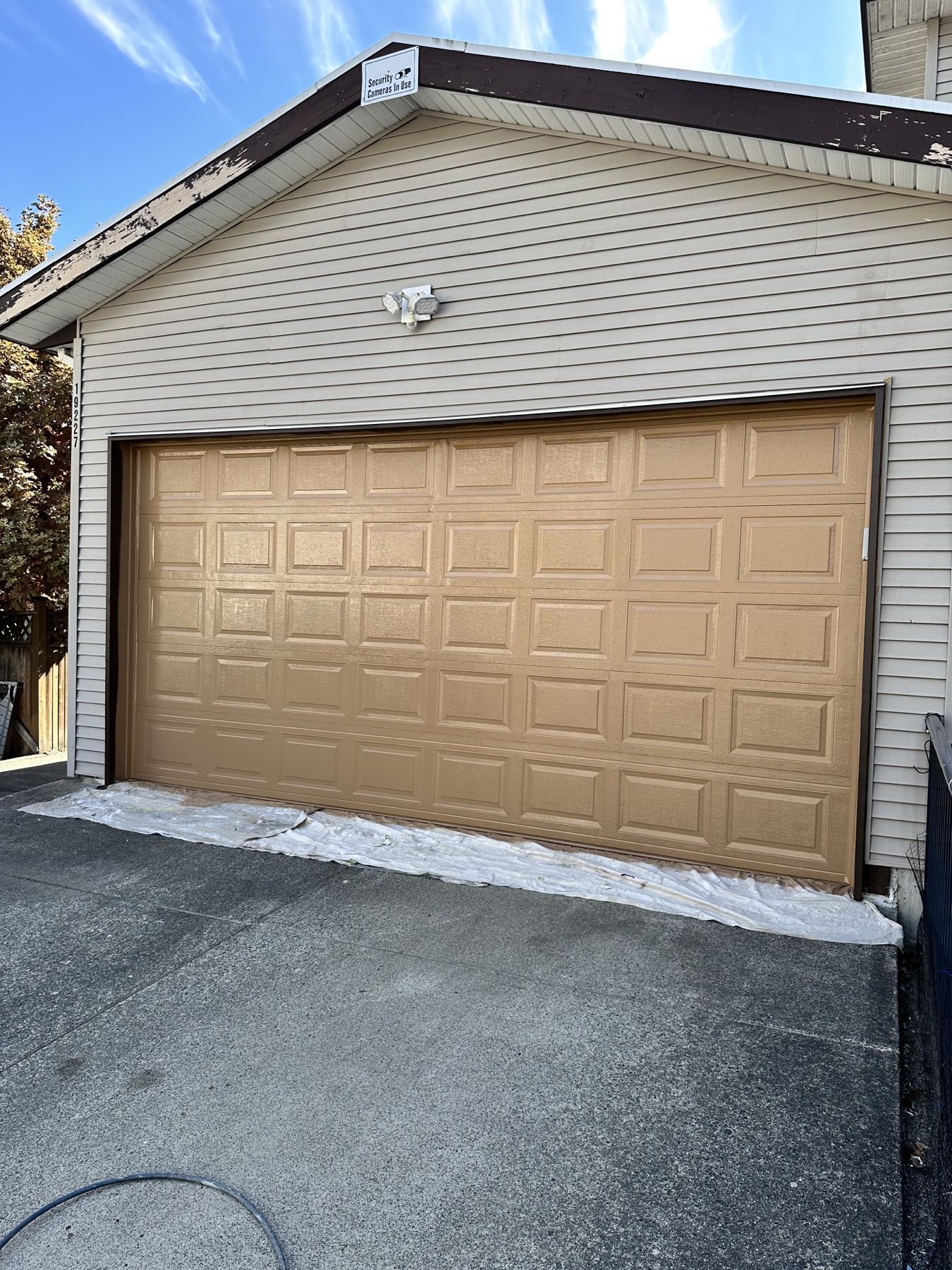 A garage and trim painted warm tan