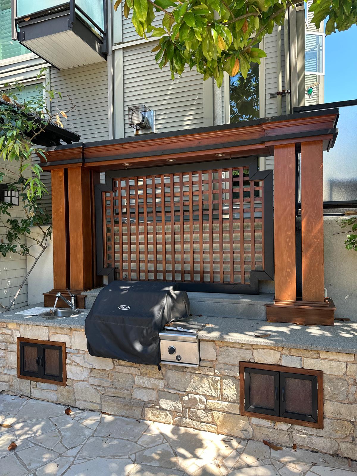 A stained pergola and gate